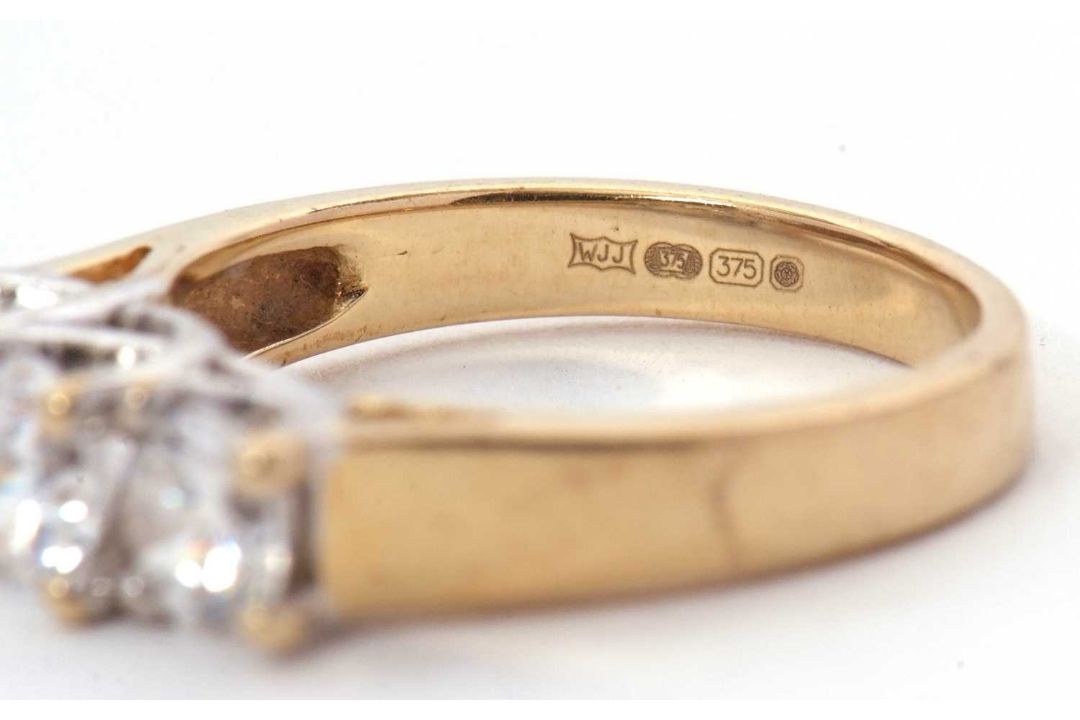 A 9ct CZ ring, the three round CZ's with tapering shoulders and plain band stamped 375 with - Image 8 of 8