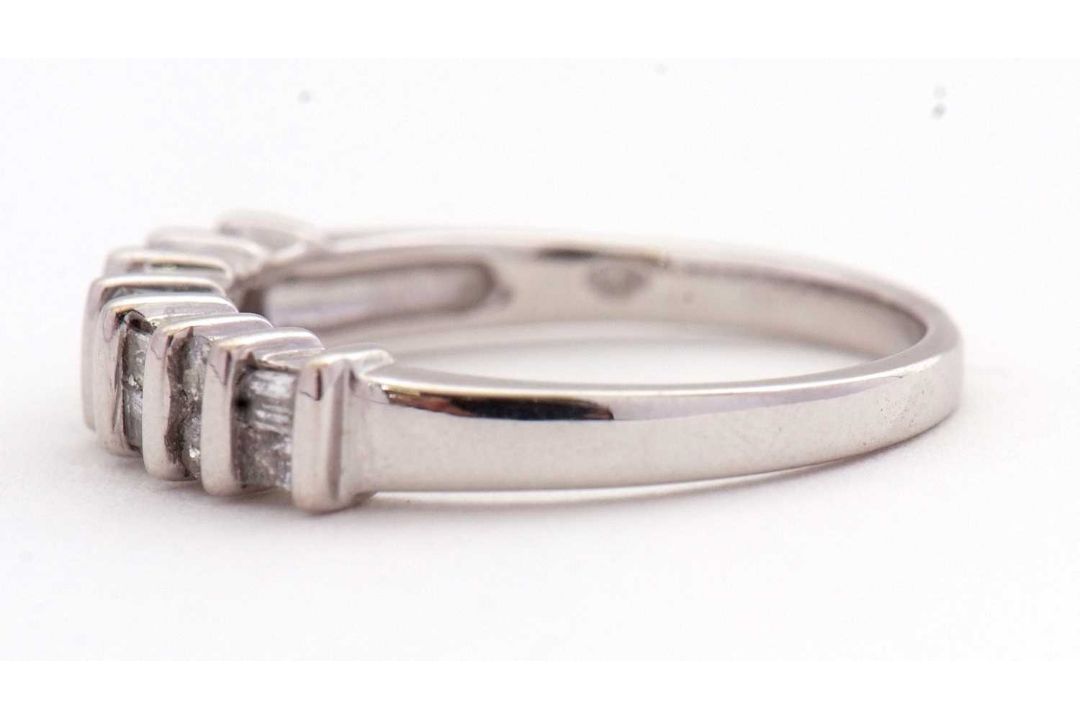 A 14K diamond ring, alternatively set with two baguette and two round brilliant cut diamonds, - Image 7 of 7
