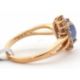 A 9ct sapphire and white zircon ring, the central oval sapphire cabochone, surrounded by small round - Image 3 of 6