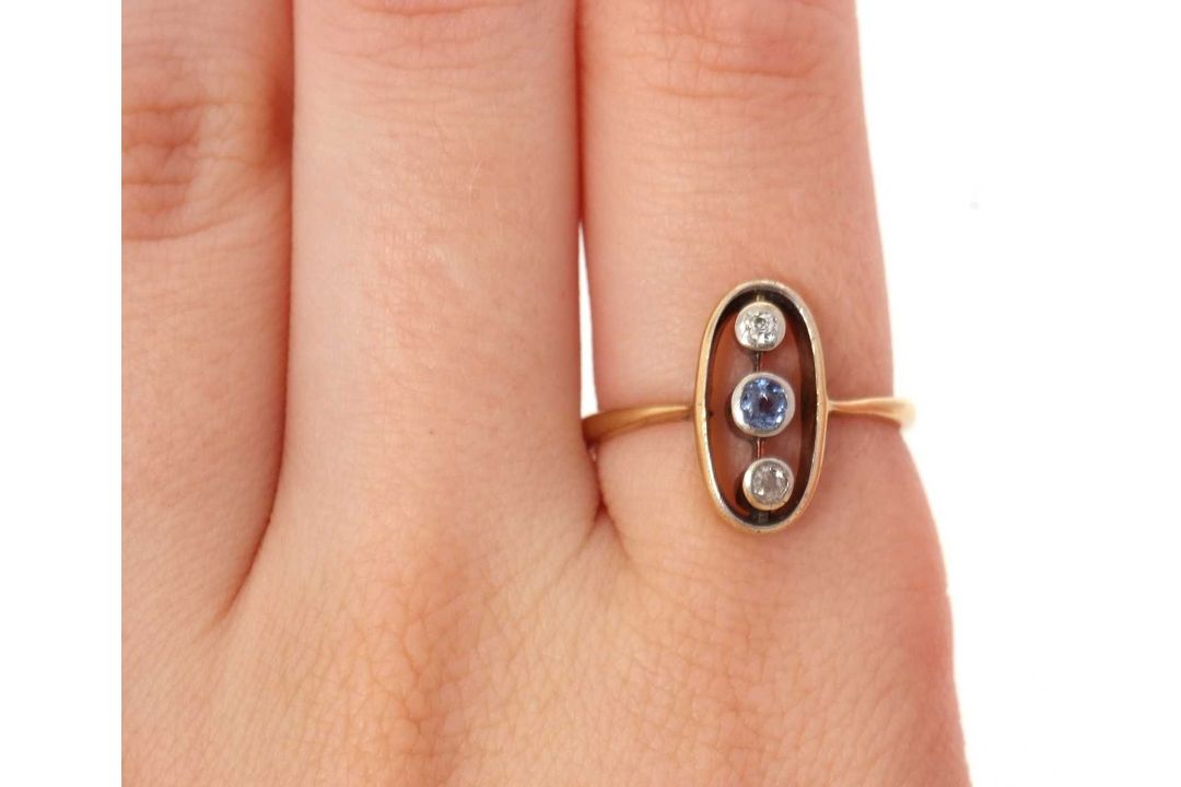 A sapphire and diamond ring, the oval frame with two collet mounted old mine cut diamonds and a - Image 7 of 7