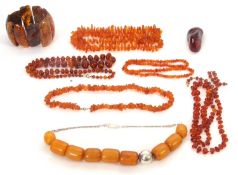 A quantity of amber and others similar: to include amber bead necklaces, a reconstituted amber