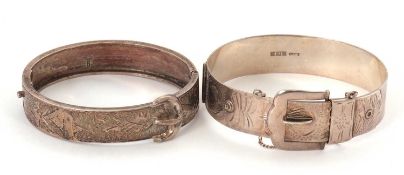 Two silver bangles: a buckle bangle, 15mm wide, hallmarked Birmingham 1972, inner diameter 62mm,