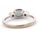 A 9ct sapphire and diamond ring, the oval blue-green sapphire set to either side with a round - Image 4 of 8