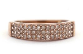 A diamond ring, set with three rows of small round brilliant cut diamonds, total estimated approx.