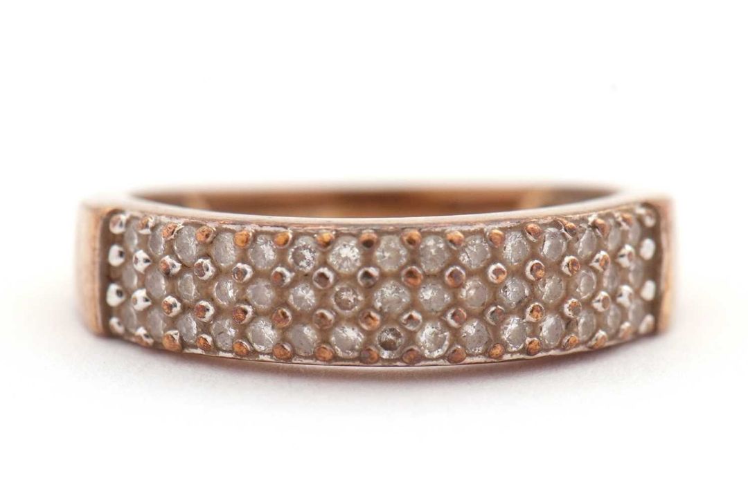 A diamond ring, set with three rows of small round brilliant cut diamonds, total estimated approx. - Image 1 of 6