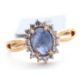 A 9ct sapphire and white zircon ring, the central oval sapphire cabochone, surrounded by small round - Image 1 of 6