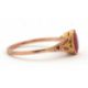 A synthetic ruby ring, the oval synthetic ruby with tapered shoulders and plain band stamped 9ct, - Image 5 of 8