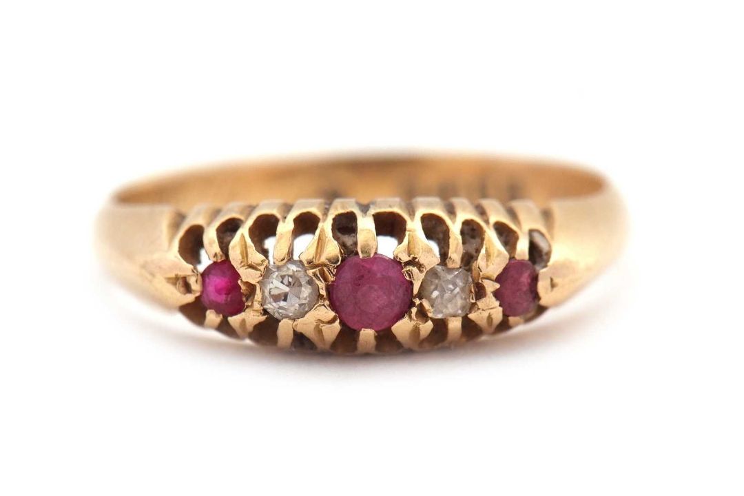 An early 20th century 18ct ruby and diamond ring, the alternating round rubies and old mine cut - Image 1 of 6