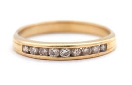 A diamond ring, quarter set with round brilliant cut diamonds, total estimated approx. 0.10cts, in