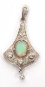A 9ct opal and diamond pendant, the early 20th century style pendant set with a central oval opal