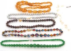 A quantity of bead necklaces, to include a pale grey cultured pearl necklace with clasp stamped 14K;