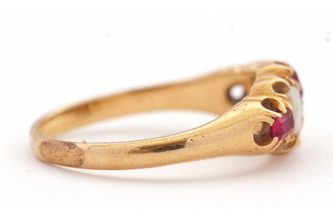 An opal and ruby ring, wtih two round opal cabochons and small round faceted rubies, with tapered - Image 3 of 6