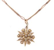 A seed pearl pendant necklace, the star shape pendant set with seed pearls, stamped 9ct, with seed