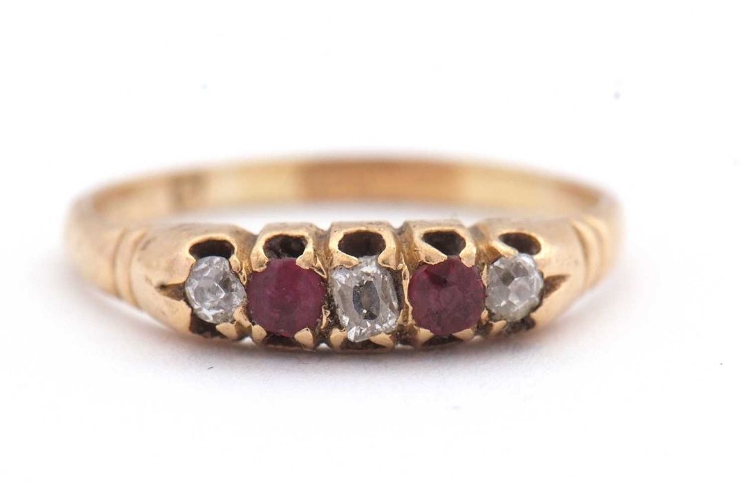 A ruby and diamond ring, set with old mine cut diamonds and mixed cut rubies, with plain band of - Image 1 of 7