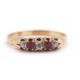 A ruby and diamond ring, set with old mine cut diamonds and mixed cut rubies, with plain band of - Image 1 of 7