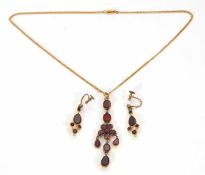 A garnet necklace and earrings, the necklace with central garnet flowerhead cluster with three drops
