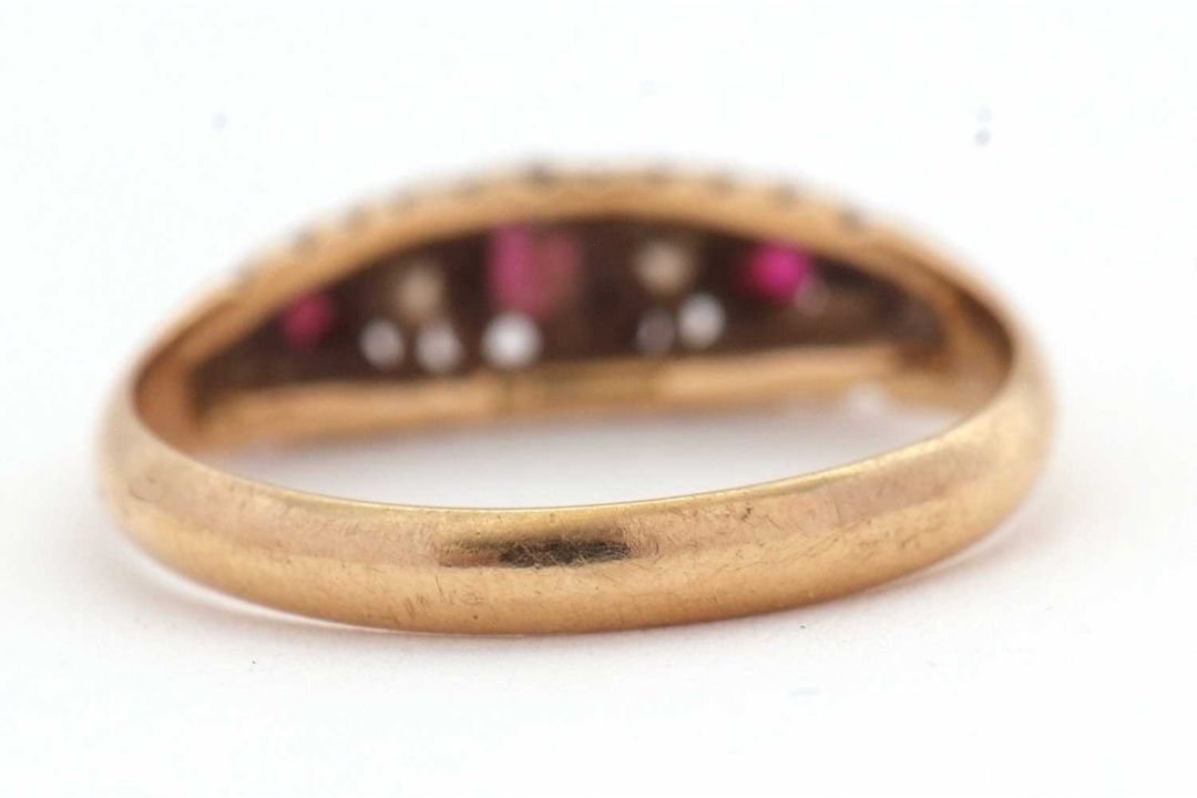 An early 20th century 18ct ruby and diamond ring, the alternating round rubies and old mine cut - Image 2 of 6