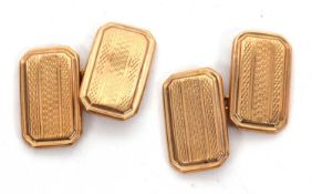 A pair of 9ct cufflinks, the rectangular cufflinks with engine turned decoration, hallmarked to