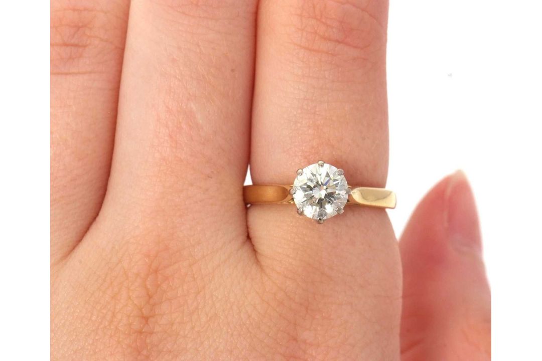 An 18ct diamond solitaire ring, the round brilliant cut dimaond, estimated approx. 1.29cts, colour - Image 6 of 7
