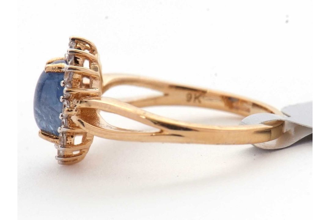 A 9ct sapphire and white zircon ring, the central oval sapphire cabochone, surrounded by small round - Image 5 of 6