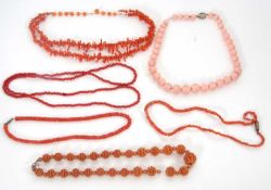 A quantity of coral and coral simulant jewellery: to include a two strand coral bead necklace with