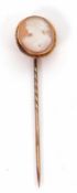 A 19th century cameo stick pin, the oval shell cameo of a lady, collet mounted with rope twist