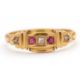 An Edwardian 18ct ruby and diamond ring, set with a central round diamond and a round ruby to either - Image 1 of 7