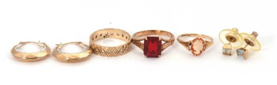 Three rings and two pairs of earrings: to include a white stone eternity ring stamped 9ct, size L,