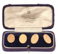 A pair of 9ct cufflinks, the oval cufflinks, engraved decoration to one half and plain the other,