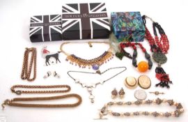 A quantity of costume jewellery: to include a Butler & Wilson necklace and a brooch, both boxed; two