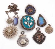 A mixed lot of silver and white metal jewellery, including silver medallions, a filigree brooch,
