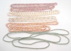A quantity of cultured pearls, to include long coloured strands in pinks and greens, etc. (5)