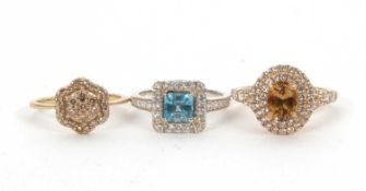Three gemset rings: to include a 9ct champagne diamond cluster ring (one stone missing),