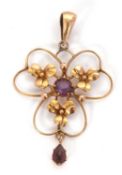 A 9ct Edwardian pendant, set with three leaf clovers and a central purple stone, with purple drop