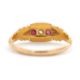 An Edwardian 18ct ruby and diamond ring, set with a central round diamond and a round ruby to either - Image 4 of 7