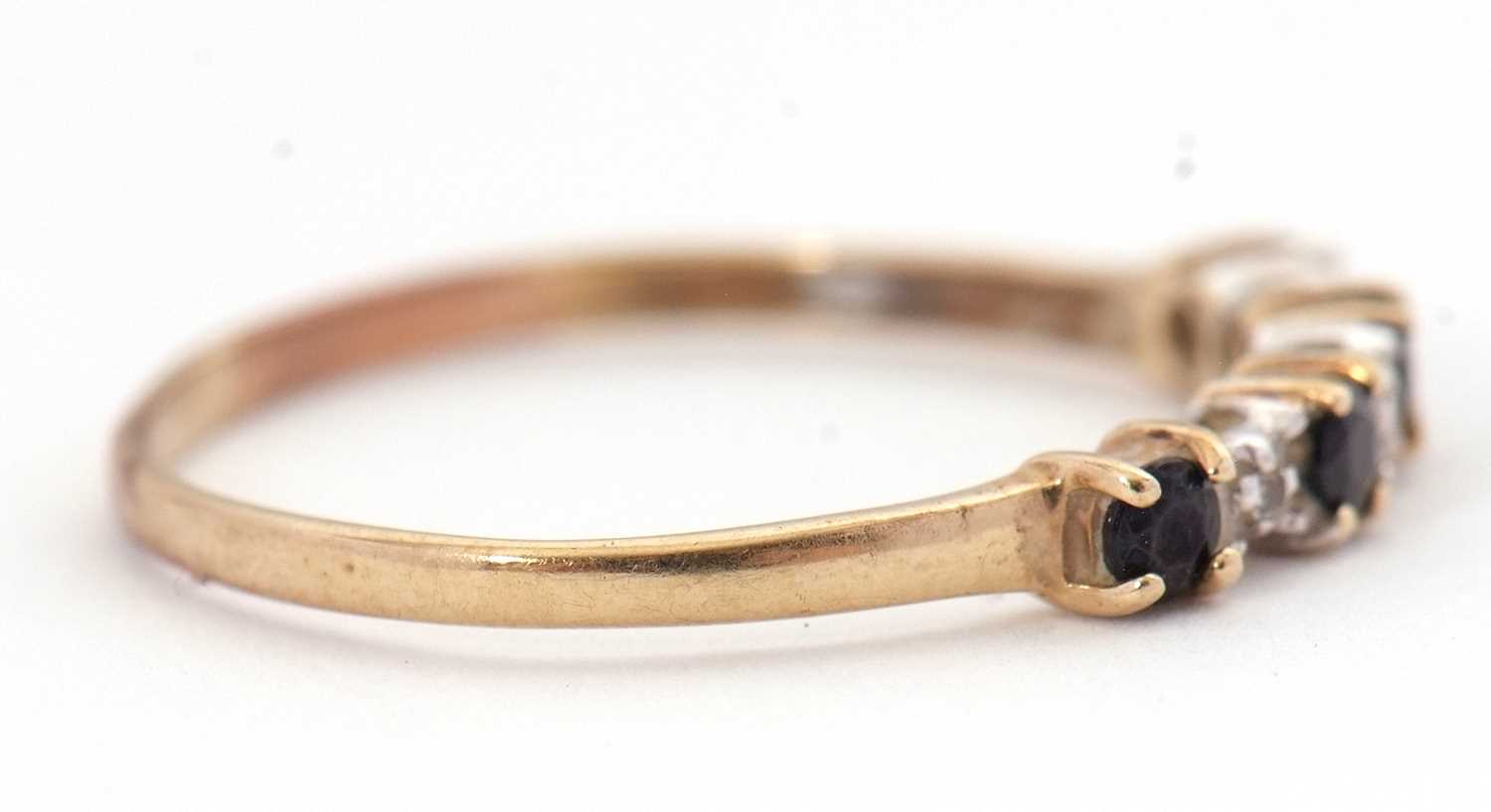 A sapphire and diamond ring, the alternating round sapphires interspaced with diamond hightlights, - Image 3 of 5