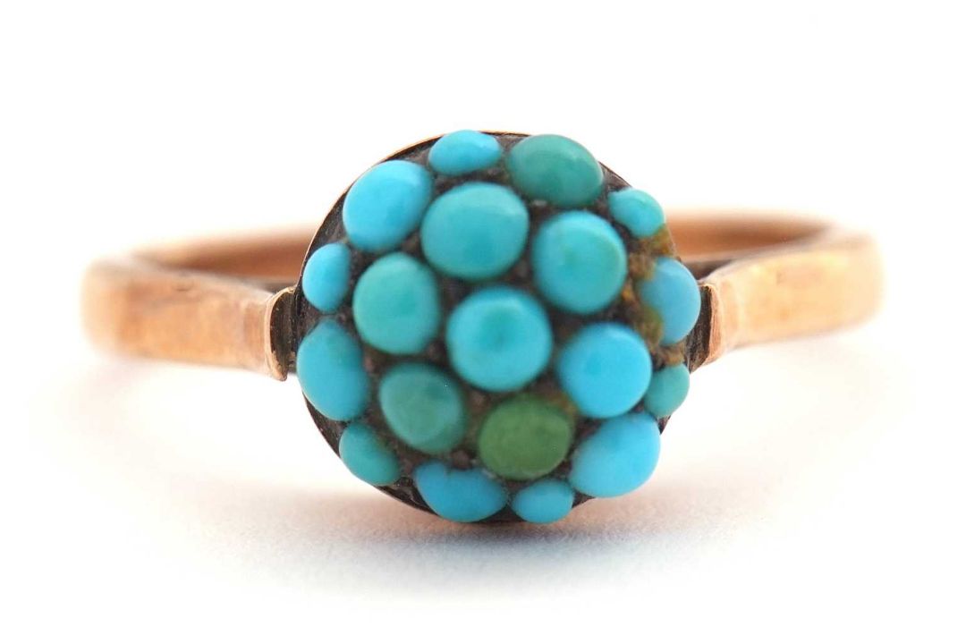 A turquoise cluster ring, the cluster composed of small turquoise cabochons, in raised mount with - Image 1 of 6