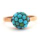 A turquoise cluster ring, the cluster composed of small turquoise cabochons, in raised mount with - Image 1 of 6