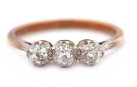 A three stone diamond ring, the three old mine cut diamonds, total estimated approx. 0.70cts, with