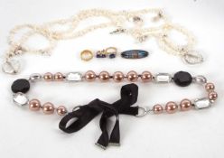 A mixed lot: to include a faux pearl and bead necklace by LK Bennett; a cultured pearl lariat; a