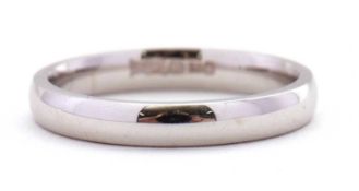 An 18ct white gold wedding band, 3mm wide, stamped 750 with London assay mark, size N, 3.5g