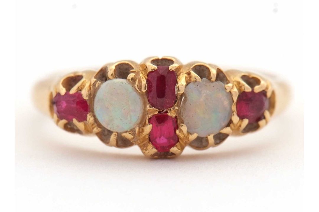 An opal and ruby ring, wtih two round opal cabochons and small round faceted rubies, with tapered - Image 6 of 6