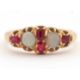 An opal and ruby ring, wtih two round opal cabochons and small round faceted rubies, with tapered - Image 6 of 6