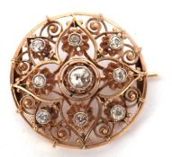 A diamond brooch, the round brooch with allover filigree design and set with old mine cut diamonds