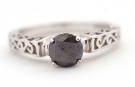 A 9ct black diamond ring, the round brilliant cut black diamond, estimated approx. 0.93cts, with