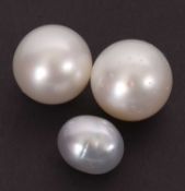 Three South Sea cultured pearls: one non-drilled 15.2mm diameter; one starter-drilled 14.4mm