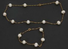 An 18K plated and cultured pearl necklace and matching bracelet, the necklace 42cm long, 12.2g,