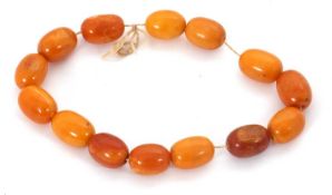 A string of butterscotch amber beads, the oval beads, approx. 13mm diameter, 24cm long, 26g