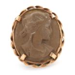 A lava cameo ring, the oval lava cameo carved with the head of a lady, claw mounted with rope