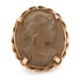 A lava cameo ring, the oval lava cameo carved with the head of a lady, claw mounted with rope - Image 1 of 5